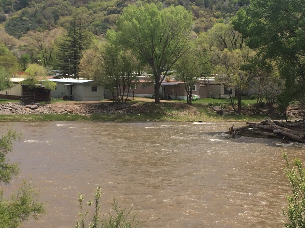 View across the Animas River of some small houses in Durango, CO